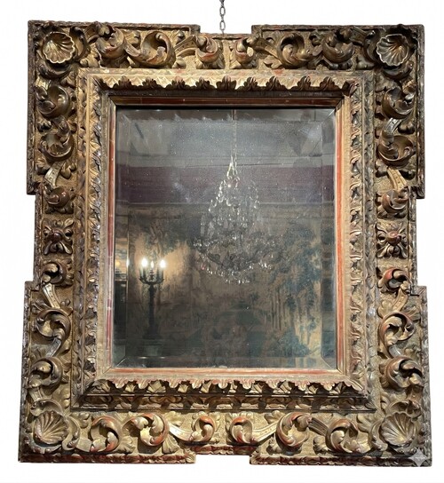 Baroque style mirror, the corners decorated with shells.