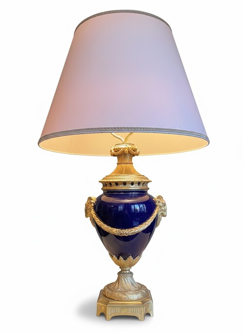 Louis XVI style electrified lamp decorated with garlands and goat heads