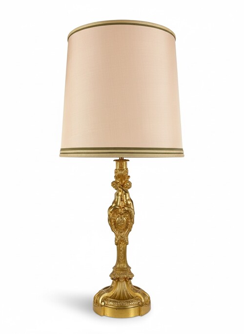 Louis XVI style electrified lamp decorated with putti and trophies with instruments