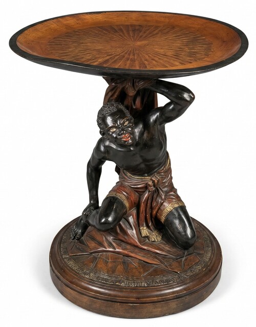 Moor-shaped gueridon supporting a carved circuar top